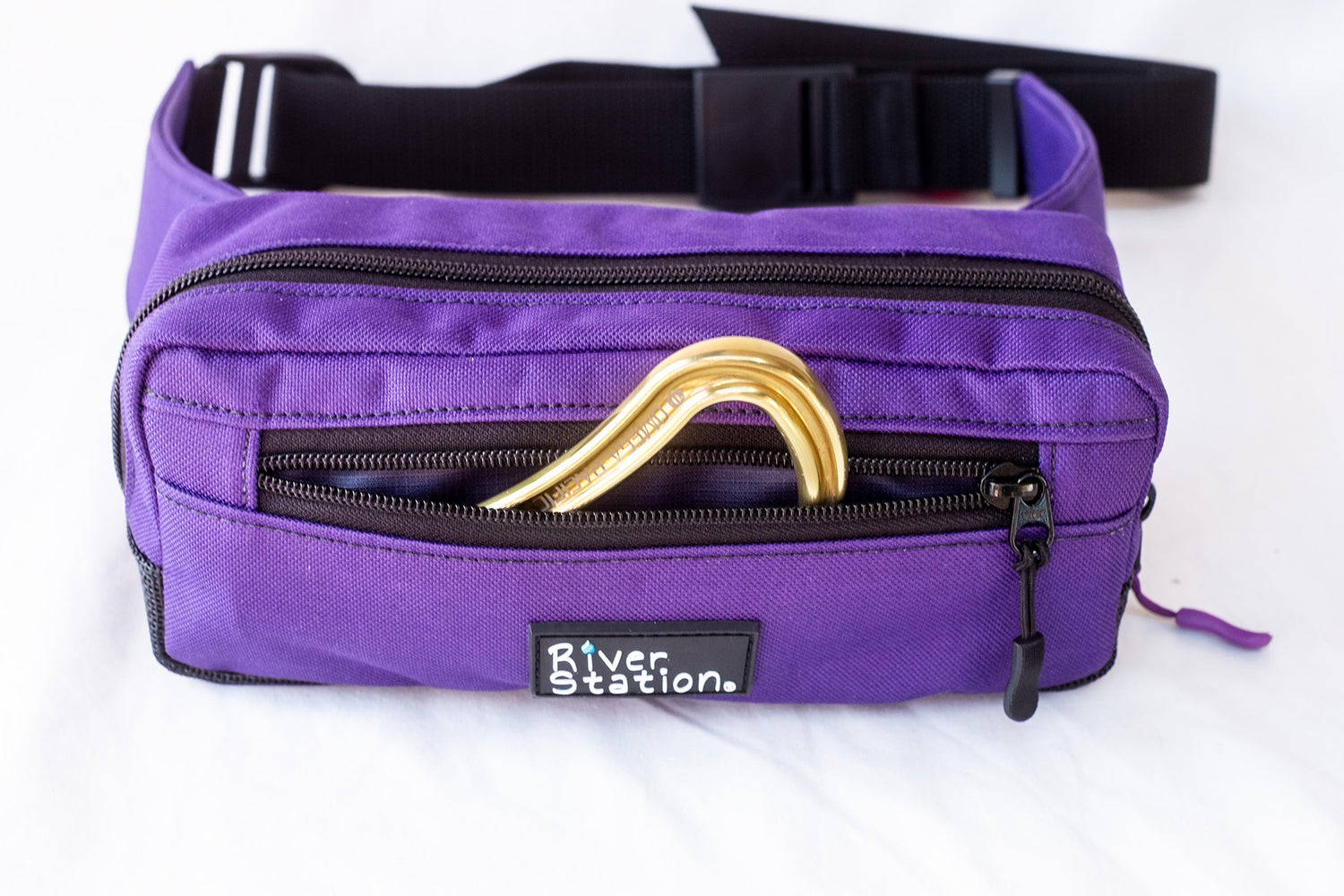 Purple waist throw bag for whitewater rafting.