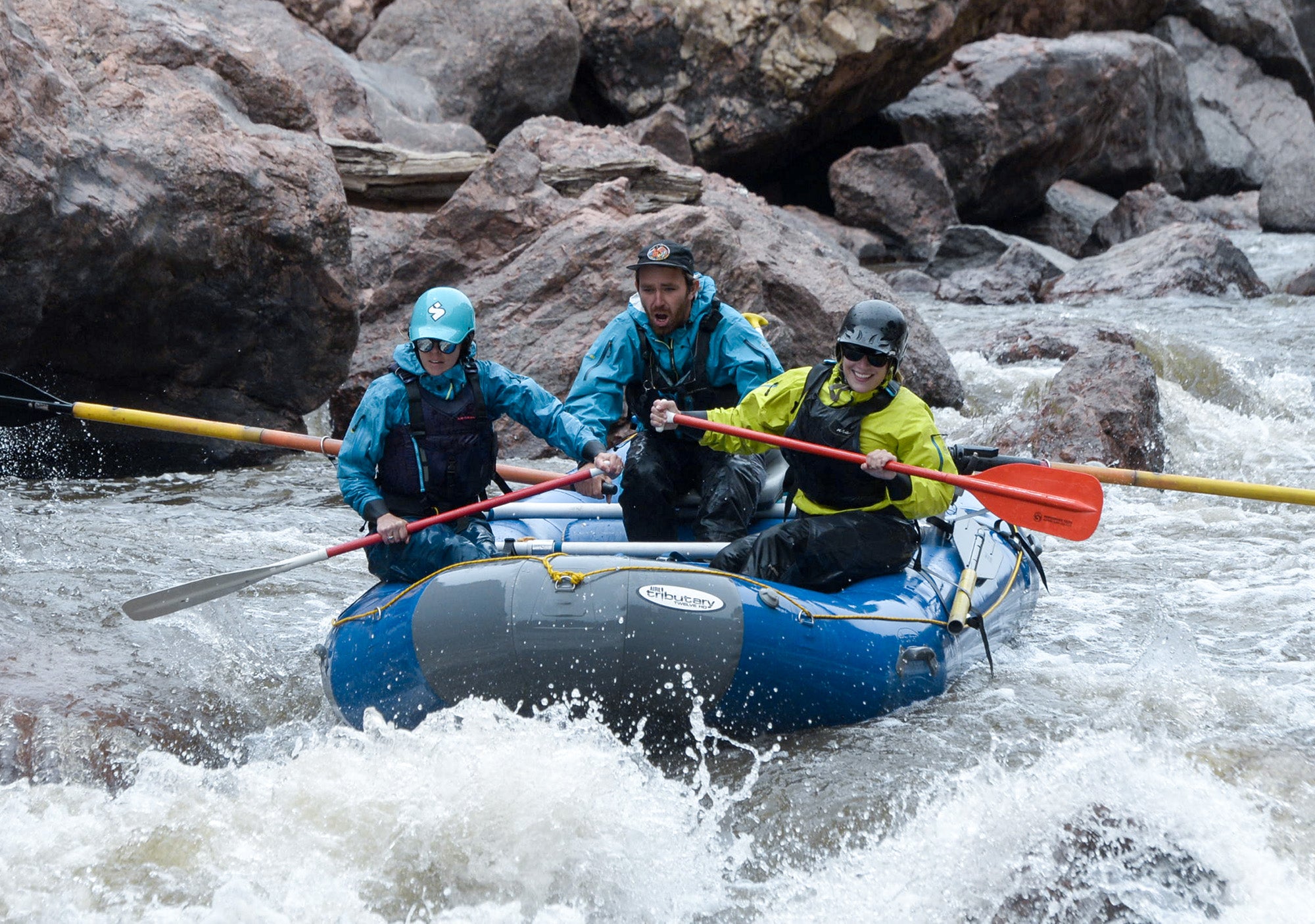 Private boaters rafting in whitewater. This is a cover photo for whitewater rafting gear and throw bag information. 