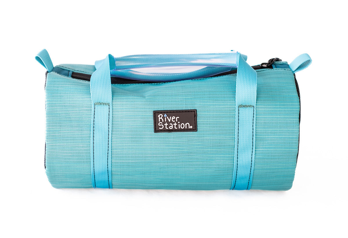 Teal mesh strap bag for whitewater rafting.